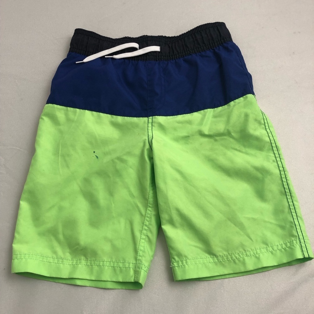 The Children’s Place blue and neon green swim trunks